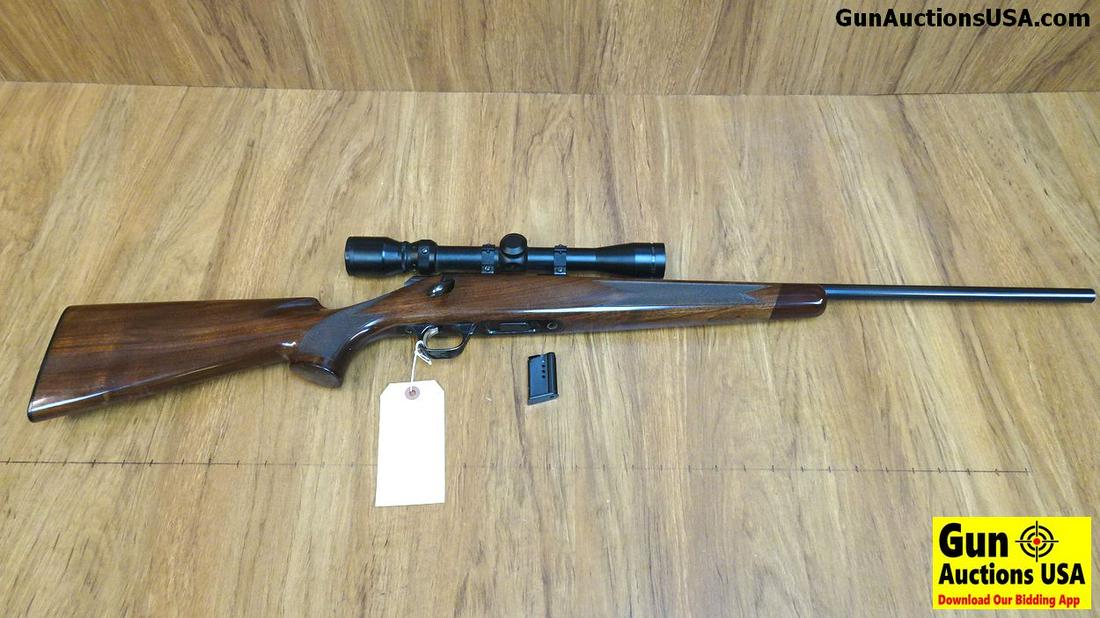 Browning A-BOLT 22 .22 LR Bolt Action Rifle. Excellent: Browning A-BOLT 22 .22 LR Bolt Action Rifle. Excellent Condition. 22" Barrel. Shiny Bore, Tight Action Wood Is Beautiful, Dark, Lots of Figure and Nice Checkering. Bluing is Outstanding, Wears a Simmo