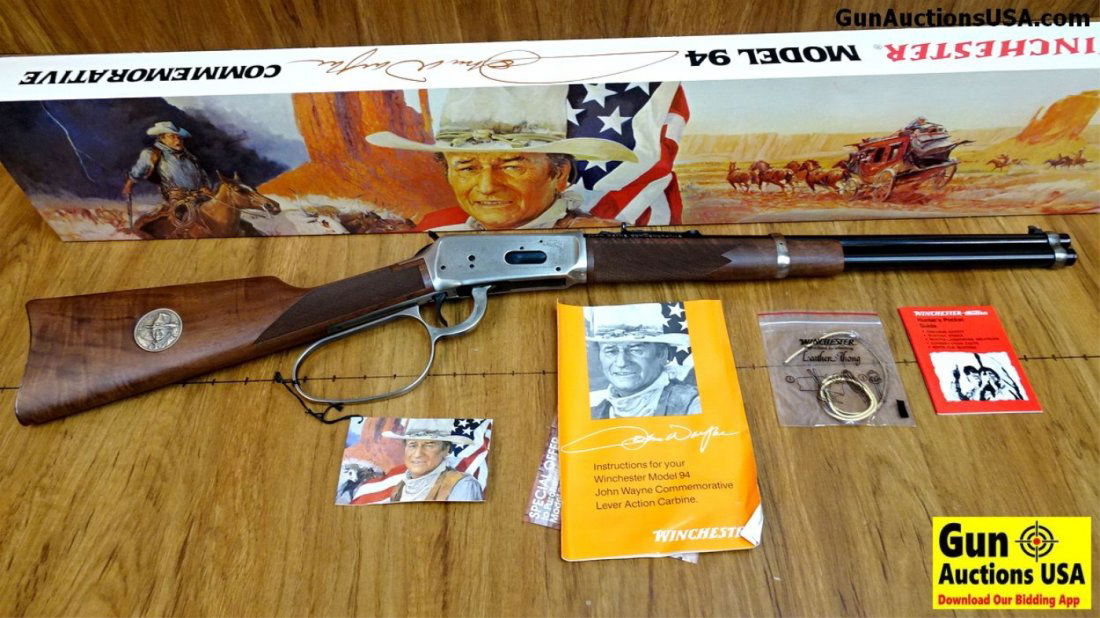 Winchester 94 JOHN WAYNE COMMEMORATIVE .32-40 WIN: Winchester 94 JOHN WAYNE COMMEMORATIVE .32-40 WIN Commemorative Rifle. NEW in Box. 18.5" Barrel. The Carbine Winchester Built to Commemorate John Wayne! Silver Large Lever Loop, Receiver and Barrel Ba