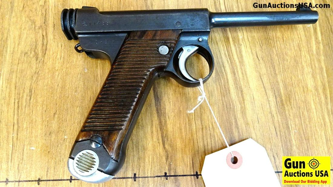 JAPANESE NAMBU 8 X 22 MM Collector's Pistol. Very Good.: JAPANESE NAMBU 8 X 22 MM Collector's Pistol. Very Good. 4.5" Barrel. Shiny Bore, Tight Action Early Type 14, Manufactured March 3,1930 at the TOKYO Arsenal. Bluing is Turning Patina, Grips are In Very