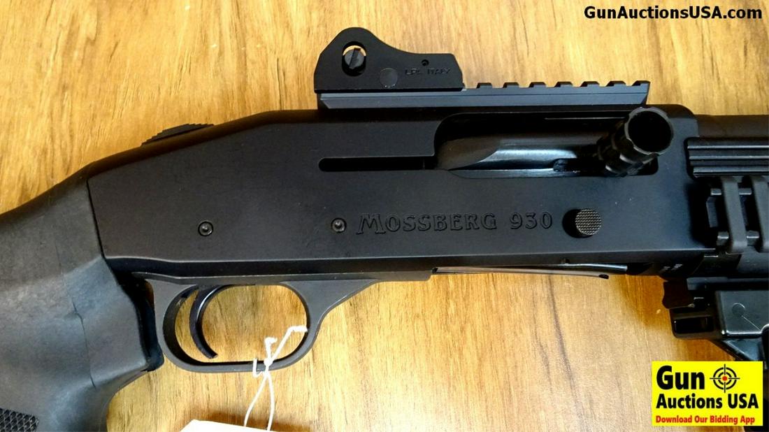 Mossberg 930 12 ga. COMBAT Shotgun. Excellent: Mossberg 930 12 ga. COMBAT Shotgun. Excellent Condition. 18" Barrel. Shiny Bore, Tight Action An Exciting Combat Shotgun, Barrel has High Raised Fiberoptic Sight with Protective Ears. Chambered for 2 
