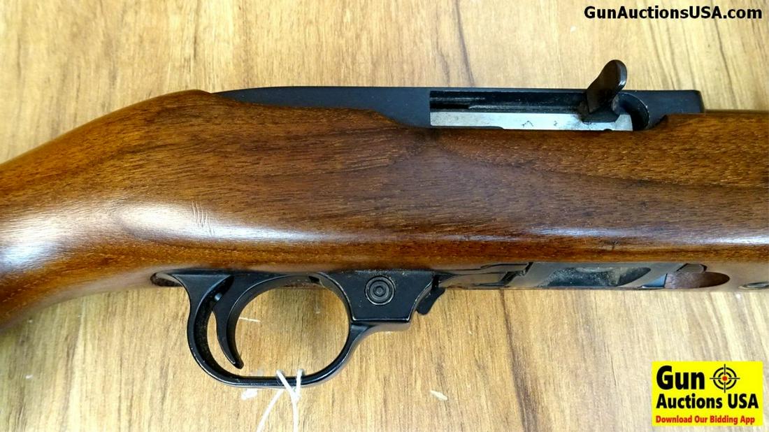 Ruger 10-22 .22 LR Rifle. Very Good. 18" Barrel. Shiny: Ruger 10-22 .22 LR Rifle. Very Good. 18" Barrel. Shiny Bore, Tight Action Factory Iron Sights Are in Tact, Receiver is Drilled Tapped and Plugger. This is a Older Model with Metal Trigger Guard, One 1