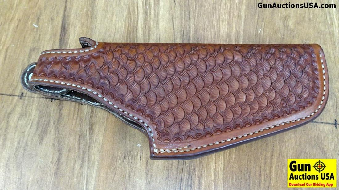 El Paso Saddlery Holster. Excellent Condition. For a: El Paso Saddlery Holster. Excellent Condition. For a S&W Model 19, Scalloped Hand Tooled Leather, Canted Belt Attachment and is Suede Lined. One of the Best Holster Manufacturer's in the World. They D