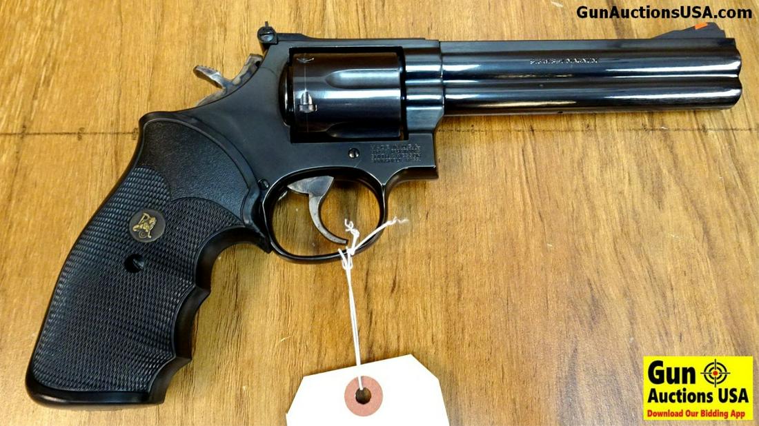 Smith & Wesson 586-2 .357 MAGNUM Revolver. Excellent: Smith & Wesson 586-2 .357 MAGNUM Revolver. Excellent Condition. 6" Barrel. Shiny Bore, Tight Action High Gloss Blue with Matt Top Strap, Red Ramp Front Sight with Adjustable Rear, Case Hardened Trigge