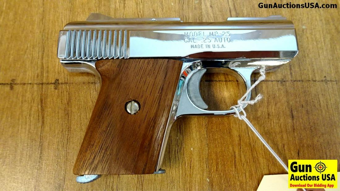 RAVEN ARMS MP-25 .25 Cal. APPEARS UNFIRED Pistol. Like: RAVEN ARMS MP-25 .25 Cal. APPEARS UNFIRED Pistol. Like New. 2.5" Barrel. Weapon Appears Unfired and is Nickel Plated, High Gloss with Straight Grain Wood Grips, Fixed Sights, Loaded Chamber Indicator 