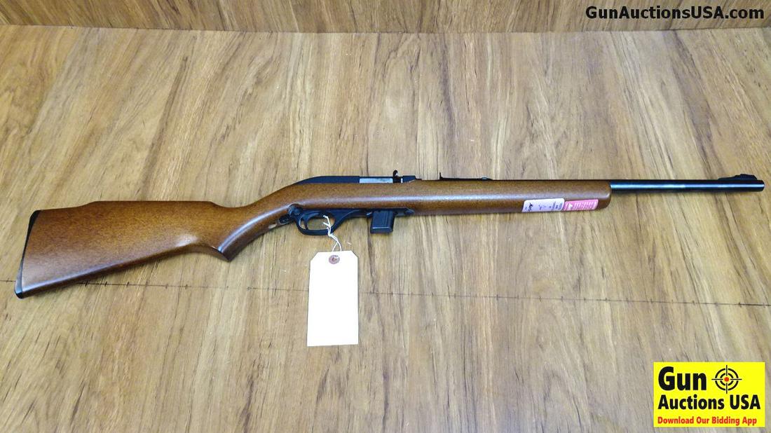 Marlin 70 .22 LR Rifle. Very Good. 18" Barrel. Shiny: Marlin 70 .22 LR Rifle. Very Good. 18" Barrel. Shiny Bore, Tight Action A Magazine Fed Semi Auto 22 with Adjustable Factory Iron Sights, Receiver is Grooved for Scope Use, Stock is Straight Grained, S