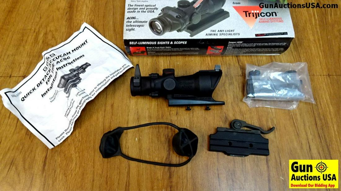 TRIGICON ACOG TA01NSN Scope. Like New. 4x32 Rifle Scope: TRIGICON ACOG TA01NSN Scope. Like New. 4x32 Rifle Scope with Yellow Center Illumination for M4 A1 with Flat Top Adaptor Back Up Iron Sights. All New in the Package. (42818)