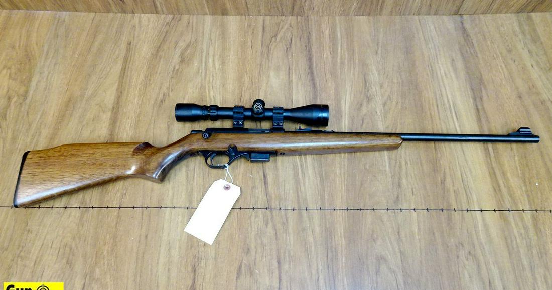 Mossberg 812 .22 WMR Rifle. Very Good. 21" Barrel.: Mossberg 812 .22 WMR Rifle. Very Good. 21" Barrel. Shiny Bore, Tight Action Magazine Fed, Blued Barreled Action with Adjustable Iron Sights, Scope Rail is Above Receiver with High Rings Holding a Simm