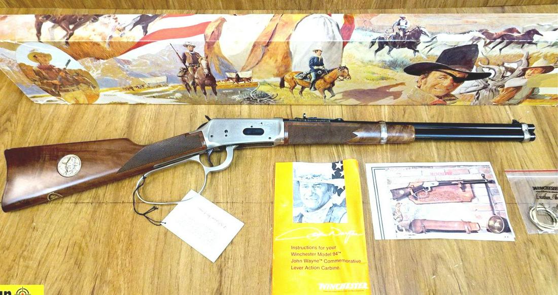 Winchester 94 JOHN WAYNE COMMEMORATIVE .32-40 WIN: Winchester 94 JOHN WAYNE COMMEMORATIVE .32-40 WIN Commemorative Rifle. NEW in Box. 18.5" Barrel. The Carbine Winchester Built to Commemorate John Wayne! Silver Large Lever Loop, Receiver and Barrel Ba