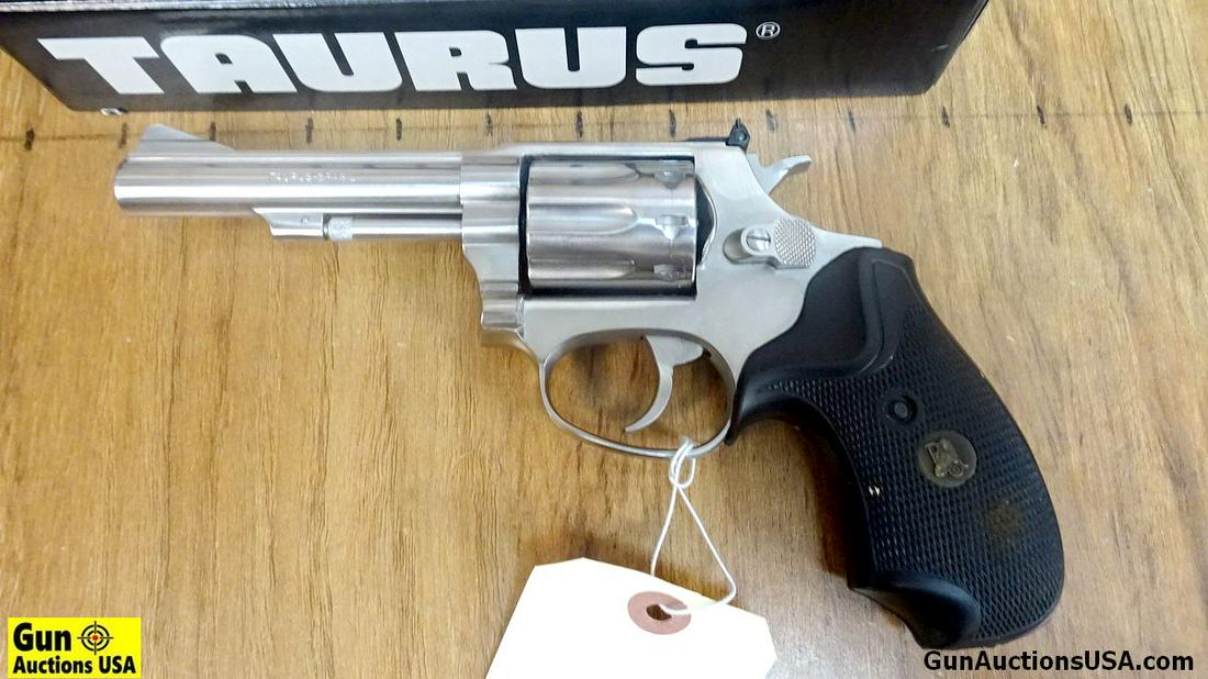 Taurus 94 .22 LR Revolver. Very Good. 4" Barrel. Shiny: Taurus 94 .22 LR Revolver. Very Good. 4" Barrel. Shiny Bore, Tight Action All Stainless Construction, 10 Shot, Adjustable Sights, Weapon is Wearing Pachmayr Compact Grips, Excellent for Trail or Range