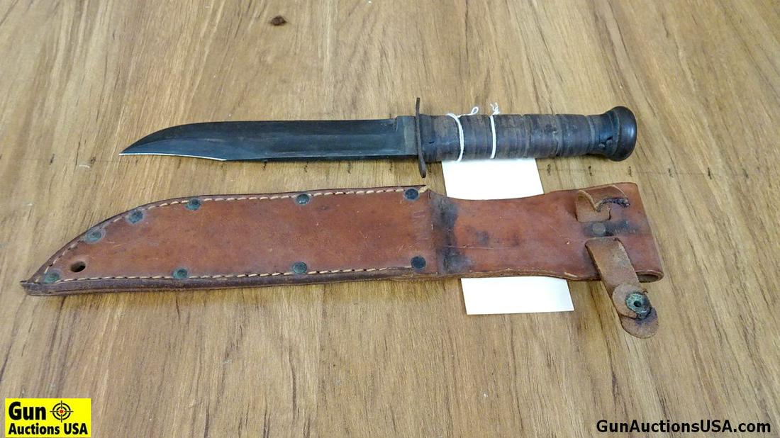 Ka-Bar Fighting Knife. Good Condition. Ka-Bar Fighting: Ka-Bar Fighting Knife. Good Condition. Ka-Bar Fighting Knife with USN leather scabbard. Knife OL 12 1/8", 7" blade with Factory Edge. Blade Marked USN. Stacked Leather Ringed Grips, Some of the Rings 