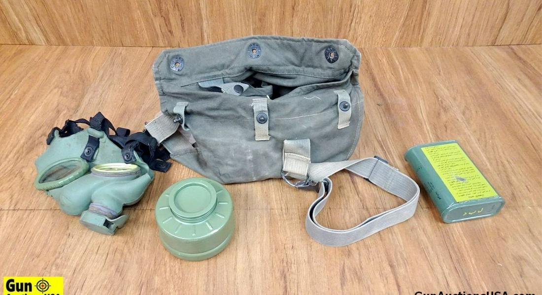 Military Surplus Gas Mask/Chemical First Aid Kit. Good: Military Surplus Gas Mask/Chemical First Aid Kit. Good Condition. Iraqi Gas Mask. Copy of Russian Gas Mask with Arab Markings, Chemical First Aid Kit. . (53711)