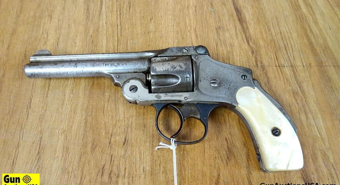 S&W LEMON SQUEEZER .38 S&W Revolver. Fair Condition. 4" Barrel. Dark Bore, Tight Action Pistol in: S&W LEMON SQUEEZER .38 S&W Revolver. Fair Condition. 4" Barrel. Dark Bore, Tight Action Pistol in the White, with Pearl Style Grips. RARE LEMON SQUEEZER Stamped " S&W, Springfield Mass. On Top of Barr