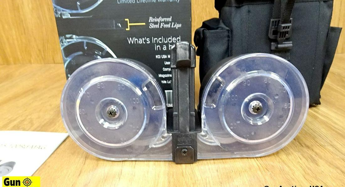 KCI 5.56/.223/.300 BLACK OUT Drum Magazine. NEW. 100 Round Magazine with Re-Enforced Steel Feed: KCI 5.56/.223/.300 BLACK OUT Drum Magazine. NEW. 100 Round Magazine with Re-Enforced Steel Feed Lips. Includes User Manual, Carry Case, Magazine Loader, and Graphite Lubrication. . (54144)