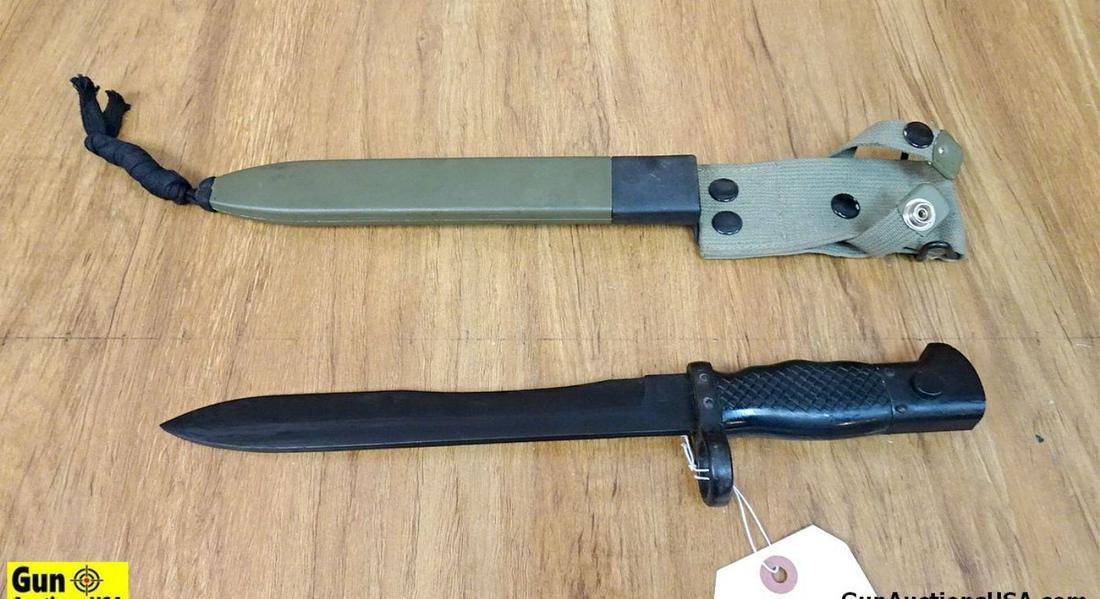Bayonet. Good Condition. Brand Bayonet with Bakelite Grips with a Olive Drab Canvas Scabbard. .: Bayonet. Good Condition. Brand Bayonet with Bakelite Grips with a Olive Drab Canvas Scabbard. . SN:E51207 (53997)