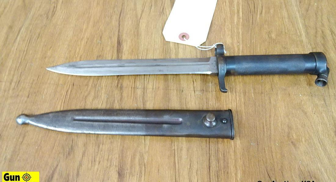 COLLECTOR'S Bayonet. Very Good. Bayonet, 8.25" Blade, 13" Overall. Stamped "702" with a Crown, Also: COLLECTOR'S Bayonet. Very Good. Bayonet, 8.25" Blade, 13" Overall. Stamped "702" with a Crown, Also Stamped "EJAB" with a Metal Scabbard. . (54557)