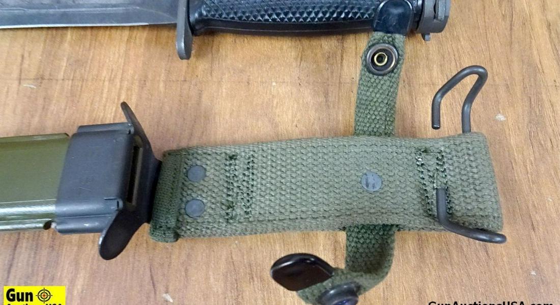Military Bayonet. Excellent Condition. Military Style Bayonet with Black Polymer Grip and Green: Military Bayonet. Excellent Condition. Military Style Bayonet with Black Polymer Grip and Green Polymer and Metal Sheath. . (54562)