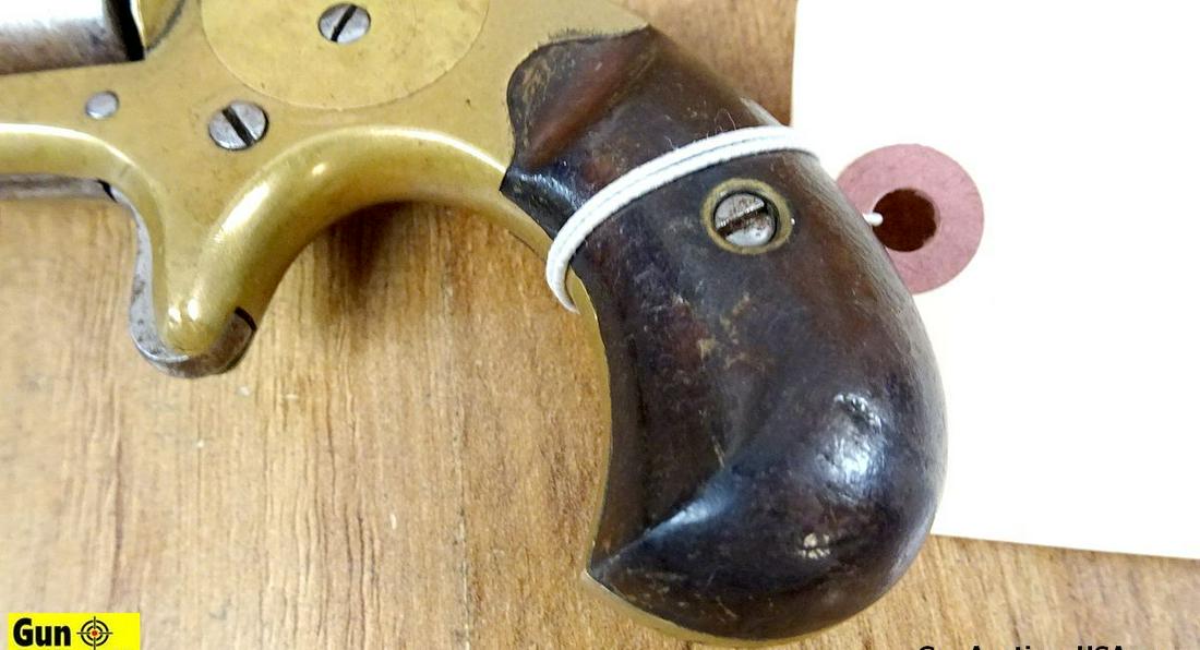 Colt .22 Caliber Single Action COLLECTOR'S Revolver. Needs Repair. 2.5" Barrel. Dark Bore Brass: Colt .22 Caliber Single Action COLLECTOR'S Revolver. Needs Repair. 2.5" Barrel. Dark Bore Brass Frame, Original Walnut Grips, Checkered Spur Hammer, 7 Shot, Non Fluted Cylinder, Barrel Stamped " COLT'