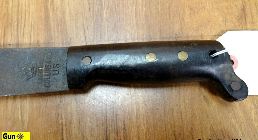 LEGITIMUS COLLINS & CO. MILITARY COLLECTOR'S Machete. Good Condition. 17.75" Blade, 23" Overall,: LEGITIMUS COLLINS & CO. MILITARY COLLECTOR'S Machete. Good Condition. 17.75" Blade, 23" Overall, Full Tang, Sharp, with a "U.S. MC" OD Polymer Scabbard. . (63773)