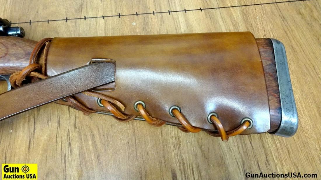 YUGO 98k MAUSER 8 MM Bolt Action Rifle. Good Condition. 23" Barrel. Dark Bore, Tight Action Owners: YUGO 98k MAUSER 8 MM Bolt Action Rifle. Good Condition. 23" Barrel. Dark Bore, Tight Action Owners Provenance States NAZI Stamped Over Stamped With YUGO Crest. Features a Leather Cheek Piece, Bayonet 