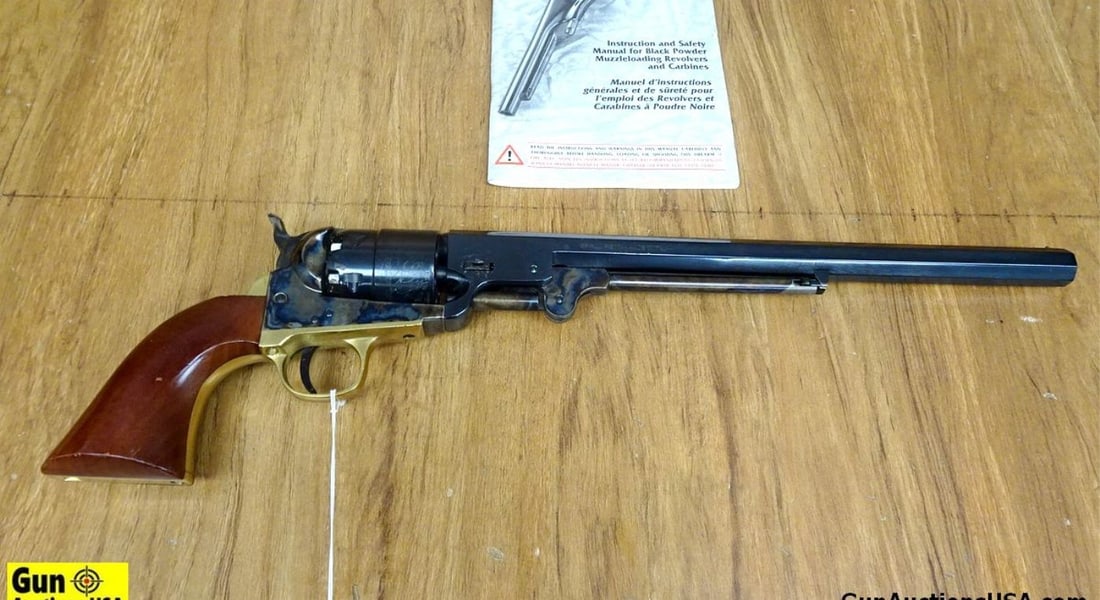 Pietta .44 Cal. Percussion Revolver. Very Good. 12" Barrel. Shiny Bore, Tight Action Features a: Pietta .44 Cal. Percussion Revolver. Very Good. 12" Barrel. Shiny Bore, Tight Action Features a Hexagonal Barrel, Engraved Naval Scene on Cylinder, Case Hardened Frame and Ramrod, Serrated Spur Hammer
