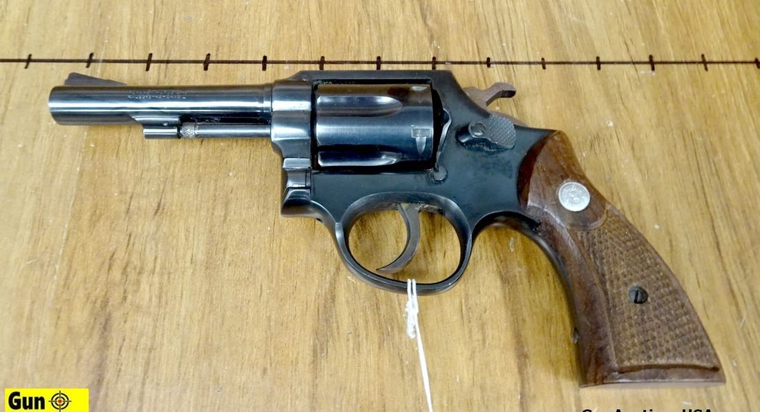Taurus .38 SPECIAL Revolver. Excellent. 4" Barrel. Shiny Bore, Tight Action Features a Front Blade: Taurus .38 SPECIAL Revolver. Excellent. 4" Barrel. Shiny Bore, Tight Action Features a Front Blade Sight, Notch Rear Frame Sight, 6 Shot Fluted Cylinder, DA/SA, Very Nice Checkered Wood Grips with Tau