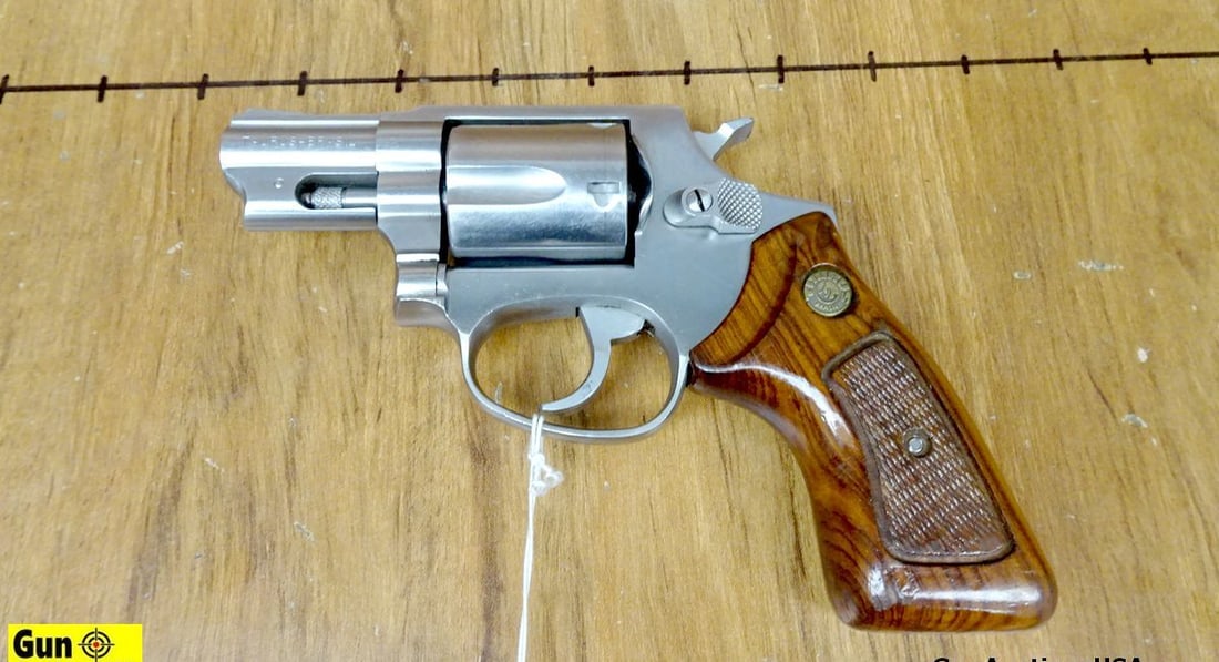 Taurus 85 .38 SPECIAL Revolver. Excellent. 2" Barrel. Shiny Bore, Tight Action Features a 5 Shot: Taurus 85 .38 SPECIAL Revolver. Excellent. 2" Barrel. Shiny Bore, Tight Action Features a 5 Shot Fluted Cylinder, DA/SA, Stainless Steel Construction, Wood Checkered Grips with Taurus Medallions. Fron
