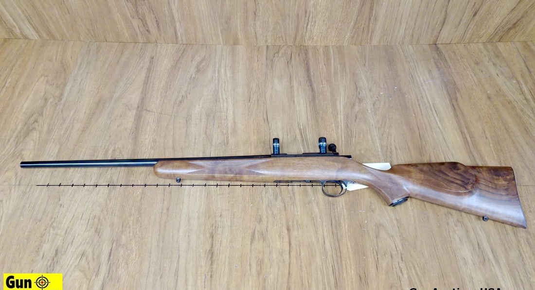 Kimber 82 .22 LR Bolt Action Rifle. Very Good. 22.5" Barrel. Shiny Bore, Tight Action Straight: Kimber 82 .22 LR Bolt Action Rifle. Very Good. 22.5" Barrel. Shiny Bore, Tight Action Straight Grained Wood Stock, Polymer Butt Plate, Cheek Rest, Receiver has Dove Tail for Scope Rings, Sling Swivel