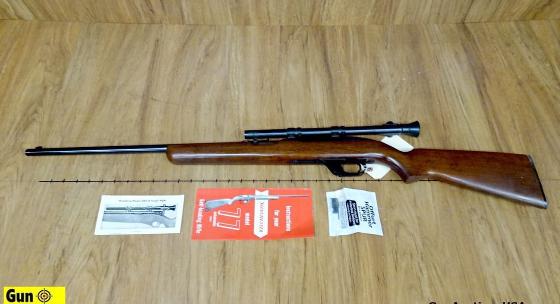 Winchester 77 .22 LR Semi Auto Rifle. Very Good. 22" Barrel. Front Blade Sight, Adjustable Notch: Winchester 77 .22 LR Semi Auto Rifle. Very Good. 22" Barrel. Front Blade Sight, Adjustable Notch Rear Sight, Blued Finish, Nice Straight Grained Wood Furniture, with Mossberg #M4D 4 Power Scope, with