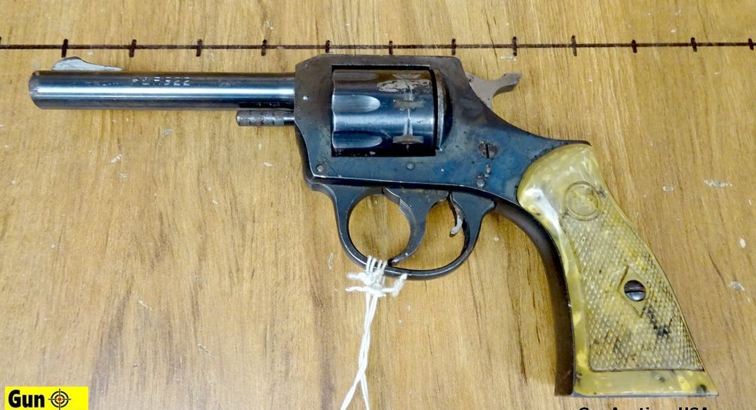 H&R 922 .22 LR Revolver. Fair Condition . 4" Barrel. 10 Shot Fluted Cylinder, DA/SA, Polymer: H&R 922 .22 LR Revolver. Fair Condition . 4" Barrel. 10 Shot Fluted Cylinder, DA/SA, Polymer Checkered Grips, with a Front Blade Sight and Notch Rear Frame Sight. Surface Rust and Blemishes on Firearm