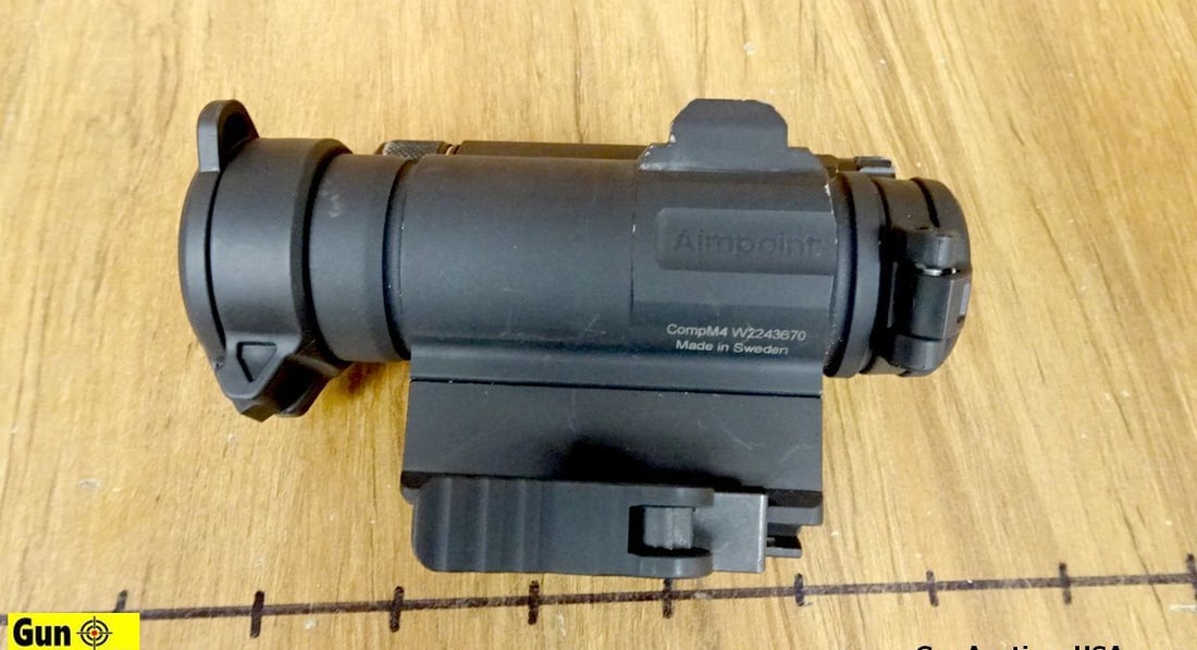 AIMPOINT COMP M4 Sight. Very Good. Red Dot Sight, Matte Black Finish, Flip Up Covers, with an: AIMPOINT COMP M4 Sight. Very Good. Red Dot Sight, Matte Black Finish, Flip Up Covers, with an American Defense Mount. . (66414)