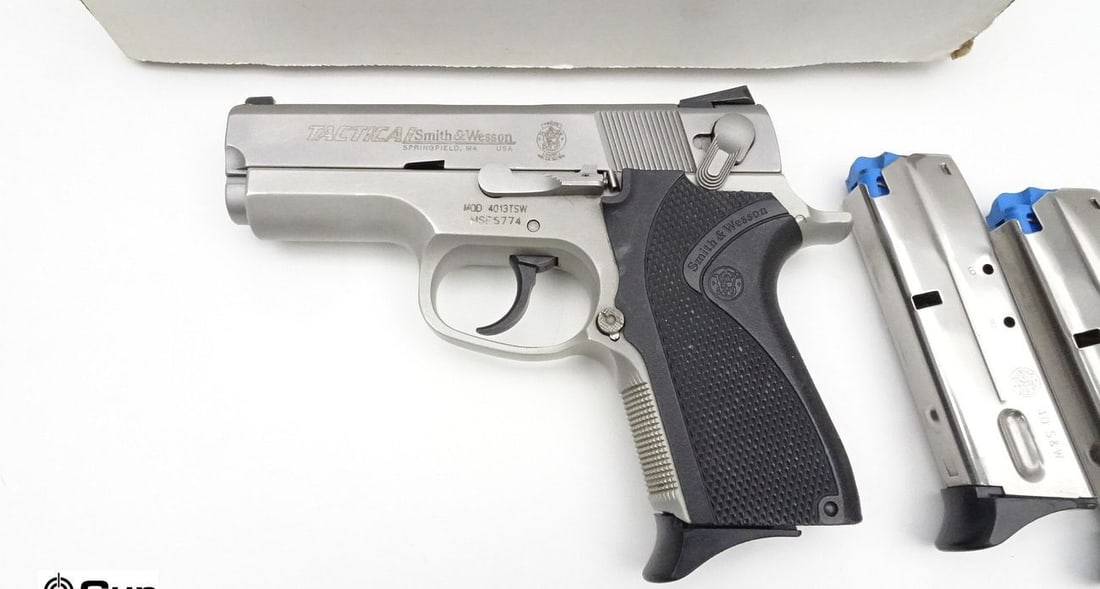 S&W 4013TSW .40 S&W Semi Auto Pistol. Excellent. 3.5" Barrel. Shiny Bore, Tight Action Features a 3 : S&W 4013TSW .40 S&W Semi Auto Pistol. Excellent. 3.5" Barrel. Shiny Bore, Tight Action Features a 3 Dot Sight System, Double Action, Ambidextrous Safety De-Cocker, with Black Polymer Checkered Grips a