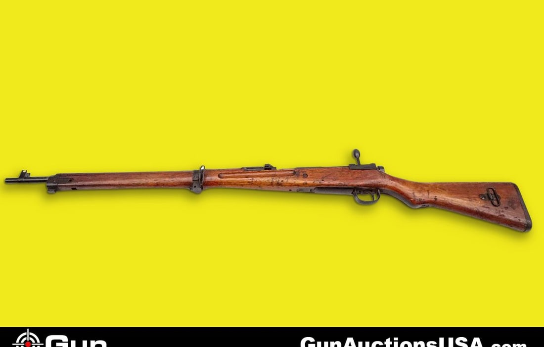 ARISAKA TYPE 99 7.7 JAP Bolt Action Rifle. Good Condition . 25.5" Barrel. Shiny Bore Factory Stampin: ARISAKA TYPE 99 7.7 JAP Bolt Action Rifle. Good Condition . 25.5" Barrel. Shiny Bore Factory Stampings on Left Side of Receiver, Front Blade Sight, Flip Up Ladder Rear Sight, Straight Grained Wood Fur