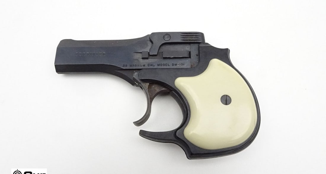 HIGH STANDARD MFG. CO. DM-101 .22 MAGNUM Derringer/Over- Under Pistol. Very Good. 3.5" Barrel. Shiny: HIGH STANDARD MFG. CO. DM-101 .22 MAGNUM Derringer/Over- Under Pistol. Very Good. 3.5" Barrel. Shiny Bores, Tight Action Deep Blue Finish, with White Polymer Grips, Front Blade Sight, and a Notch Rear