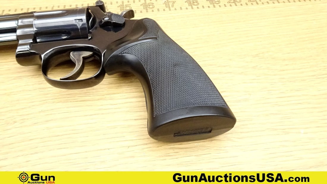 S&W 19-4 .357 MAGNUM Revolver. Good Condition. 4 1/8" Barrel. Shiny Bore, Tight Action Features a 6: S&W 19-4 .357 MAGNUM Revolver. Good Condition. 4 1/8" Barrel. Shiny Bore, Tight Action Features a 6 Shot Fluted Cylinder, Tight Action, DA/SA, Black Pachmayr Checkered Grips, Case Hardened Hammer and 