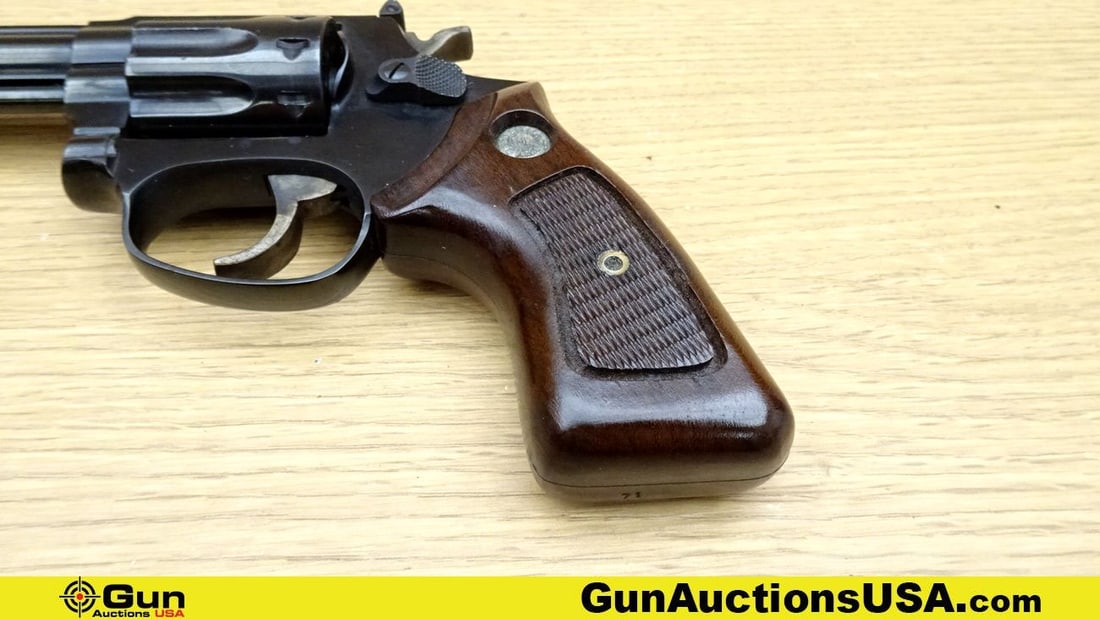 Taurus 94 .22 LR Revolver. Very Good. 4" Barrel. Shiny Bore, Tight Action Features a 9 Shot Fluted: Taurus 94 .22 LR Revolver. Very Good. 4" Barrel. Shiny Bore, Tight Action Features a 9 Shot Fluted Cylinder, DA/SA, Case Hardened Trigger and Hammer, with Checkering on Hammer Spur. Front ramp Sight, 