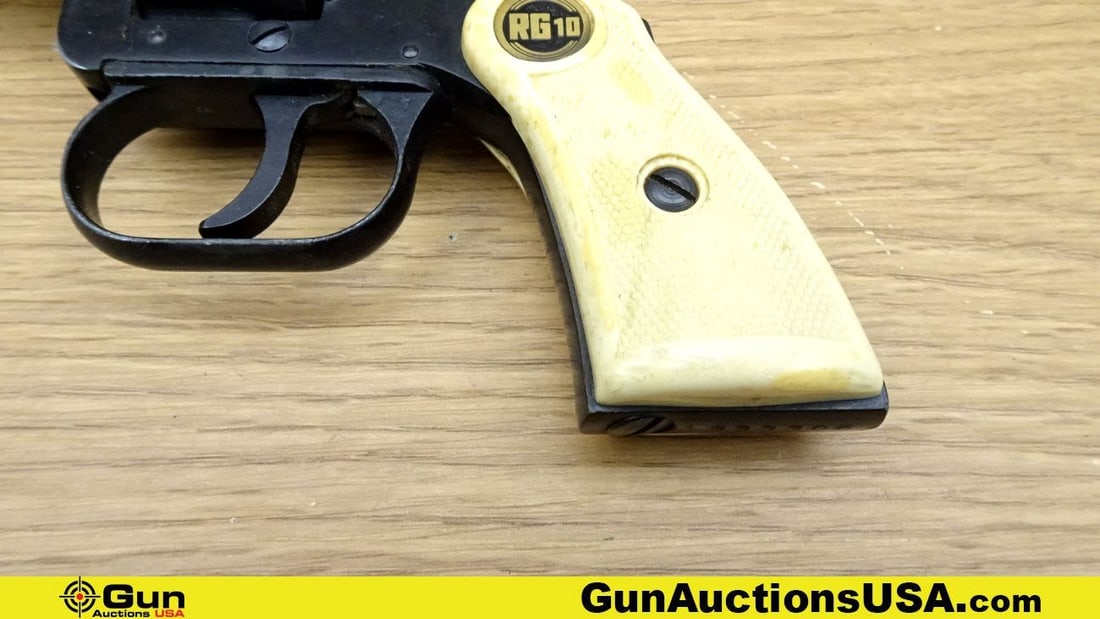 ROHM RG10 .22 Short Revolver. Good Condition. 2.5" Barrel. Shiny Bore, Tight Action Features a: ROHM RG10 .22 Short Revolver. Good Condition. 2.5" Barrel. Shiny Bore, Tight Action Features a Serrated Hammer Spur, Tight Action, White Polymer Checkered Grips with RG10 Medallions. Front Blade Sight