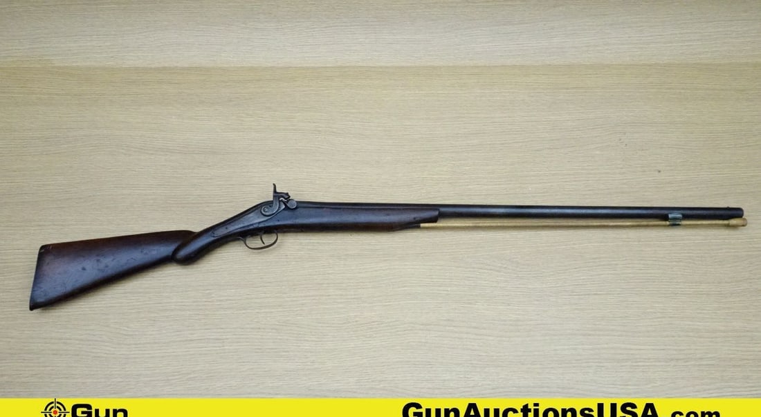 RIDDLE .63 Caliber Rifle. Good Condition. 31.5" Barrel. Dark Bore Cap and Ball Features a Front Bead: RIDDLE .63 Caliber Rifle. Good Condition. 31.5" Barrel. Dark Bore Cap and Ball Features a Front Bead Sight, Exposed Hammer, with Straight Grained Wood Furniture and a Metal Butt Plate. Charging Rod, S