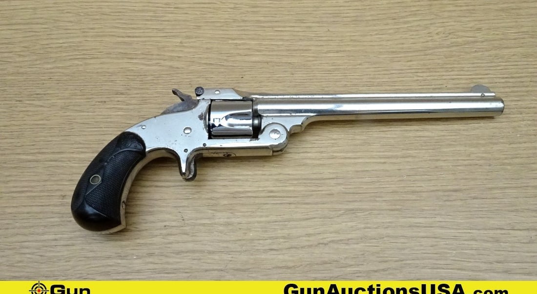 S&W TOP BREAK .32 S&W CTG Revolver. Good Condition. 6" Barrel. Shiny Bore, Tight Action Features a: S&W TOP BREAK .32 S&W CTG Revolver. Good Condition. 6" Barrel. Shiny Bore, Tight Action Features a Nickel Finish with a 5 Shot Fluted Cylinder, SA only, Checkered Hammer Spur with a Front Blade Sight 