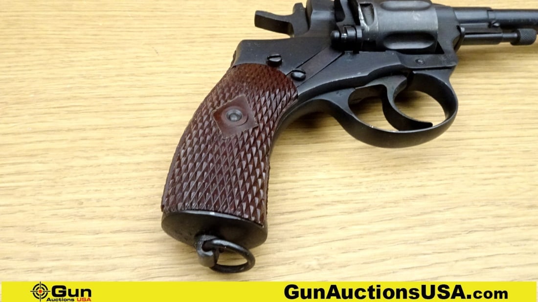 TULA NAGANT M1895 7.62 NAGANT COLLECTOR'S Revolver. Very Good. 4.5" Barrel. Shiny Bore, Tight Action: TULA NAGANT M1895 7.62 NAGANT COLLECTOR'S Revolver. Very Good. 4.5" Barrel. Shiny Bore, Tight Action DA/SA 6 Shot Revolver, Brown Bakelite Checkered Grip, Fixed Front Sight, Lanyard Loop, Side Loading