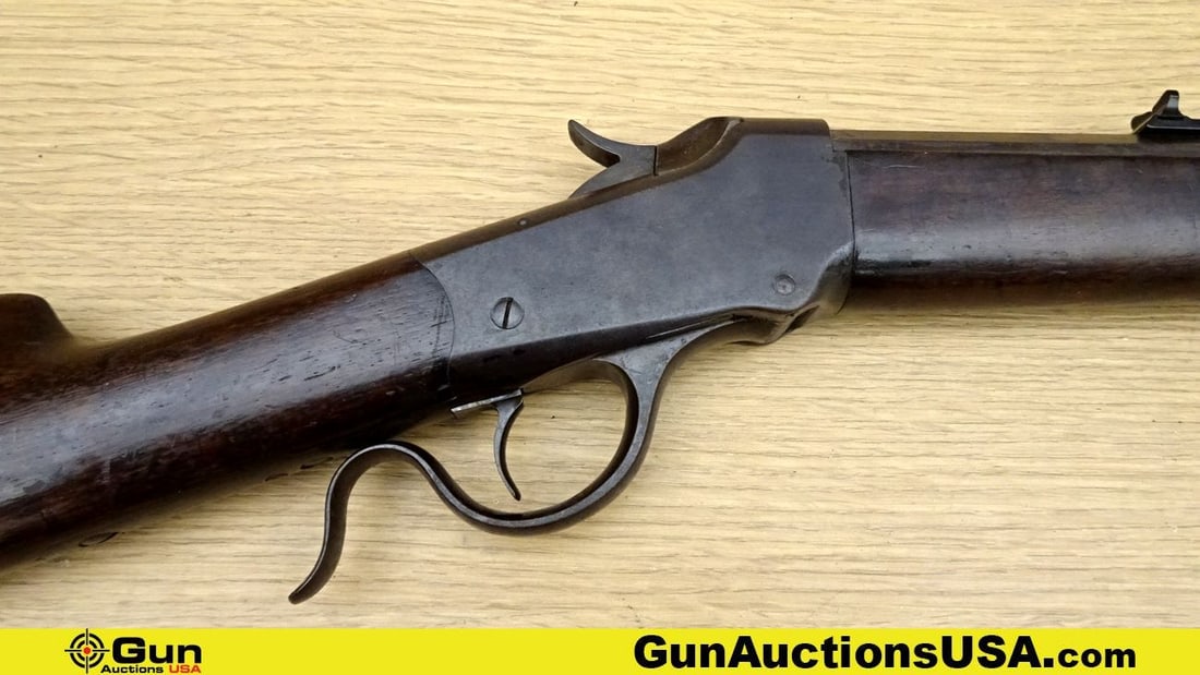 WINCHESTER 22 W.C.F. VINTAGE Rifle. Good Condition. 26" Barrel. Shiny Bore, Tight Action Falling: WINCHESTER 22 W.C.F. VINTAGE Rifle. Good Condition. 26" Barrel. Shiny Bore, Tight Action Falling Block A vintage lever-action rifle chambered in a small caliber, perfect for plinking and varmint hunti