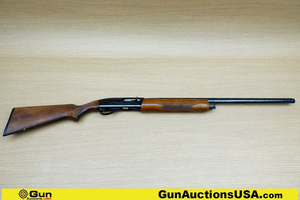 REMINGTON ARMS CO 1100 12 ga. Shotgun. Very Good. 28" Barrel. Shiny Bore, Tight Action Semi Auto: REMINGTON ARMS CO 1100 12 ga. Shotgun. Very Good. 28" Barrel. Shiny Bore, Tight Action Semi Auto Features Very Nice Straight Grained Wood Stock, Engraved Bolt and Receiver, with a Stainless Steel Bolt