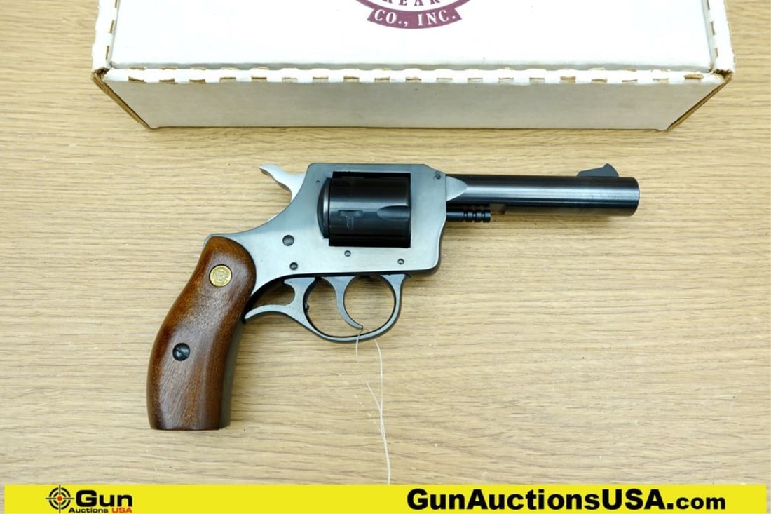New England Firearms R73 .32 H&R MAGNUM COLLECTOR'S Revolver. Excellent. 4" Barrel. Shiny Bore,: New England Firearms R73 .32 H&R MAGNUM COLLECTOR'S Revolver. Excellent. 4" Barrel. Shiny Bore, Tight Action Features a Blued Barrel, Frame, and a 5 Shot Fluted Cylinder. Fixed Front Blade Sight, Very