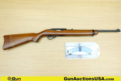 Ruger 10-22 .22 LR Rifle. Good condition, Normal Handling Marks, Scattered Spotting and/or Pitting.