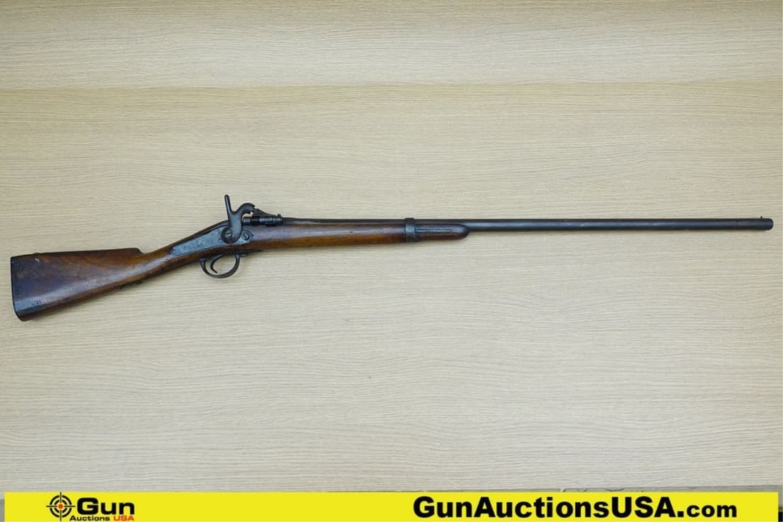 BRITISH SNIDER ZULU 12 ga. Shotgun. Fair Condition. 34" Barrel. Breech Load In Original Patina, with: BRITISH SNIDER ZULU 12 ga. Shotgun. Fair Condition. 34" Barrel. Breech Load In Original Patina, with Walnut Stock, Dog's Head Side Lock, Metal Butt Plate, Firing Pin is Smooth, with a Crisp Trigger. F