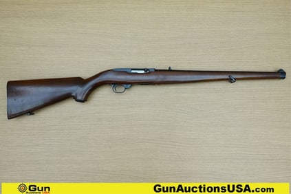 Ruger 10-22 .22 LR Rifle. Good condition, Normal Handling Marks, Scattered Spotting and/or Pitting.