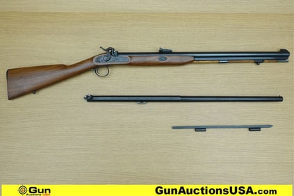 THOMPSON CENTER NEW ENGLANDER .50 Caliber Rifle. Good condition, Normal Handling Marks, Scattered