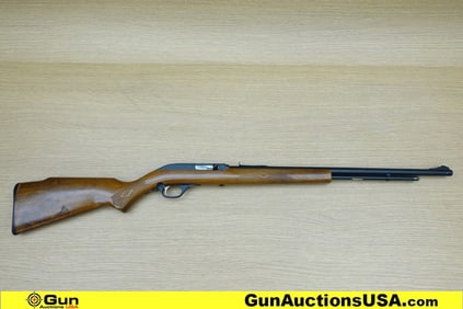 Marlin 60 .22 LR Rifle. Good condition, Normal Handling Marks, Scattered Spotting and/or Pitting.