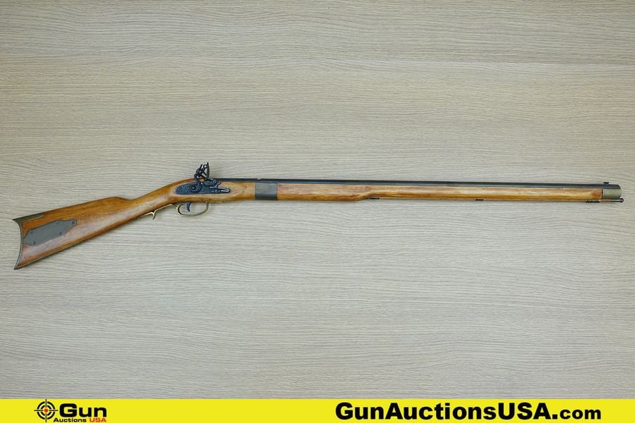 ULTRA-HI MIROKU .45 Caliber Rifle. Good condition, Normal Handling Marks, Scattered Spotting and/or: ULTRA-HI MIROKU .45 Caliber Rifle. Good condition, Normal Handling Marks, Scattered Spotting and/or Pitting. 32" Barrel. BLACK POWDER Features Straight Grained Wooden Stock, Brass Butt Plate, Engraved