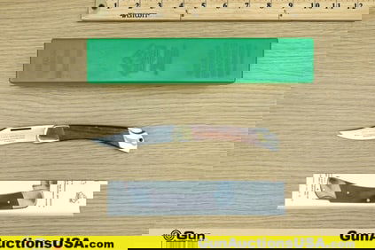 Puma 970 Game Warden Folding Knife. Very Good. Features a Wood and Brass Handle, Stainless Steel