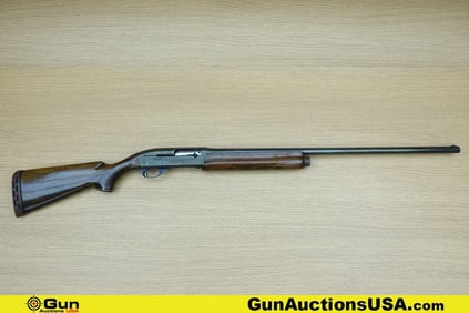 REMINGTON 1100 12 ga. Shotgun. Good condition, Normal Handling Marks, Scattered Spotting and/or
